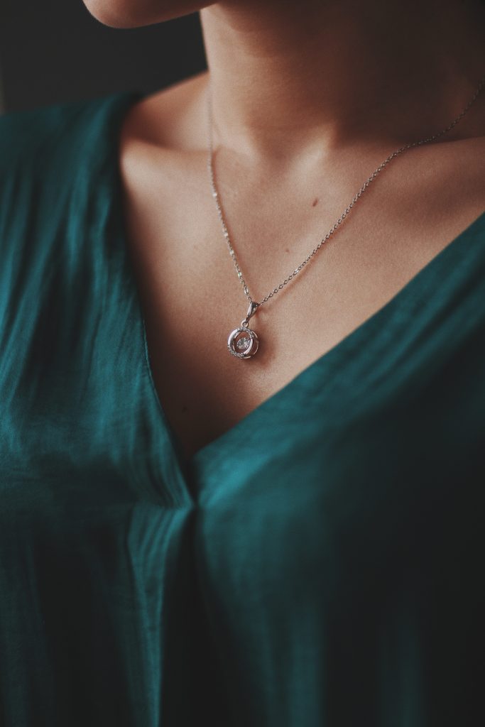 Woman wearing diamond pendant necklace, Nagpur